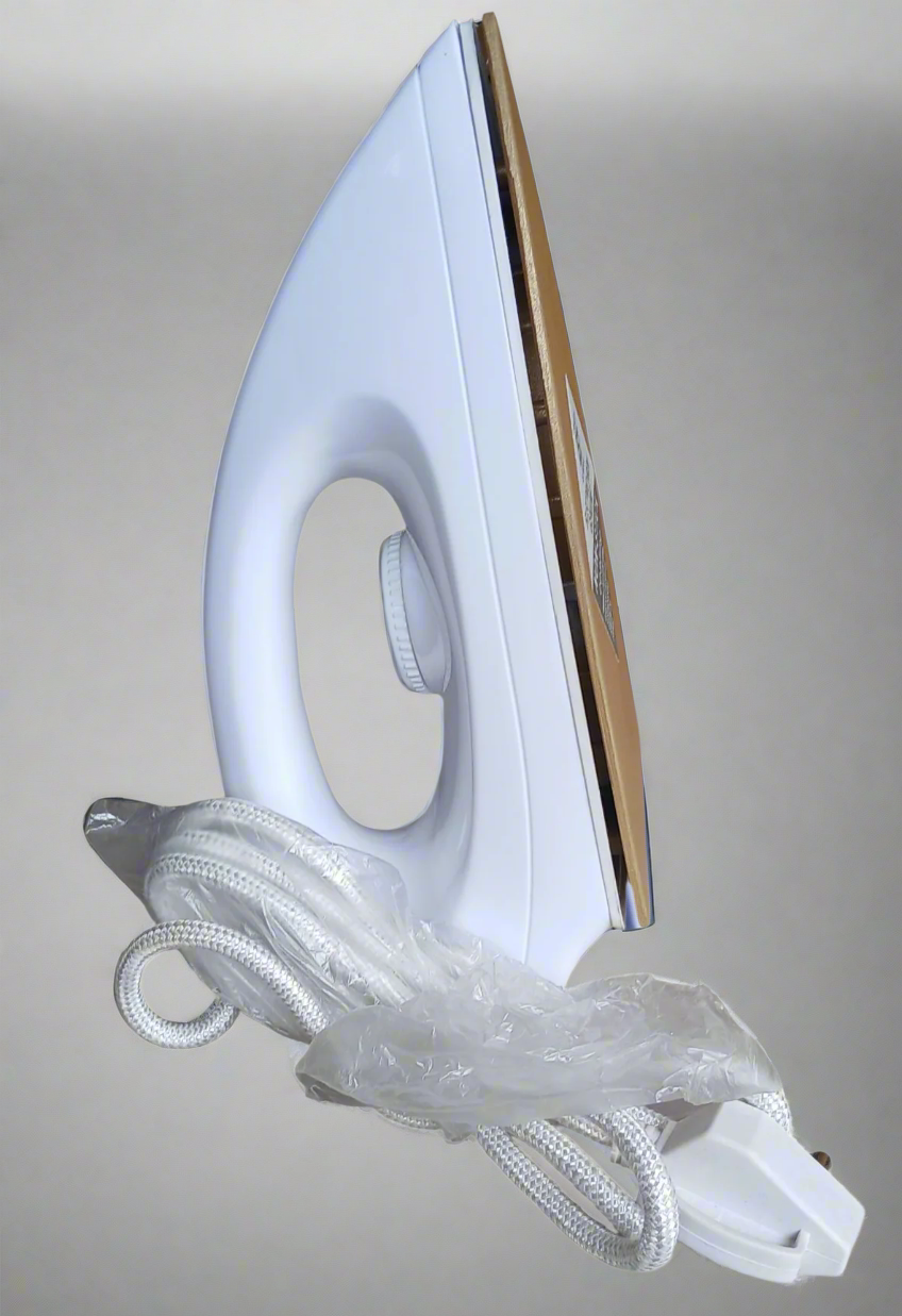 White iron with a coiled white cord on a white background